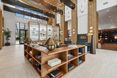 A room with a wooden bookshelf and a lamp.
