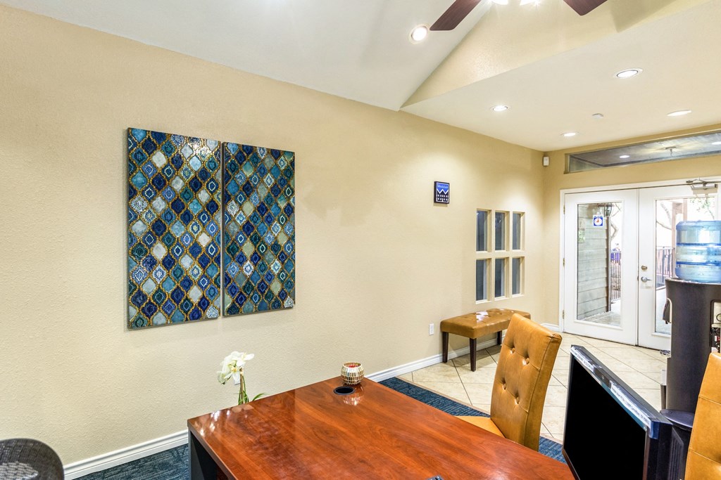 a conference room with a table and chairs and a fireplace