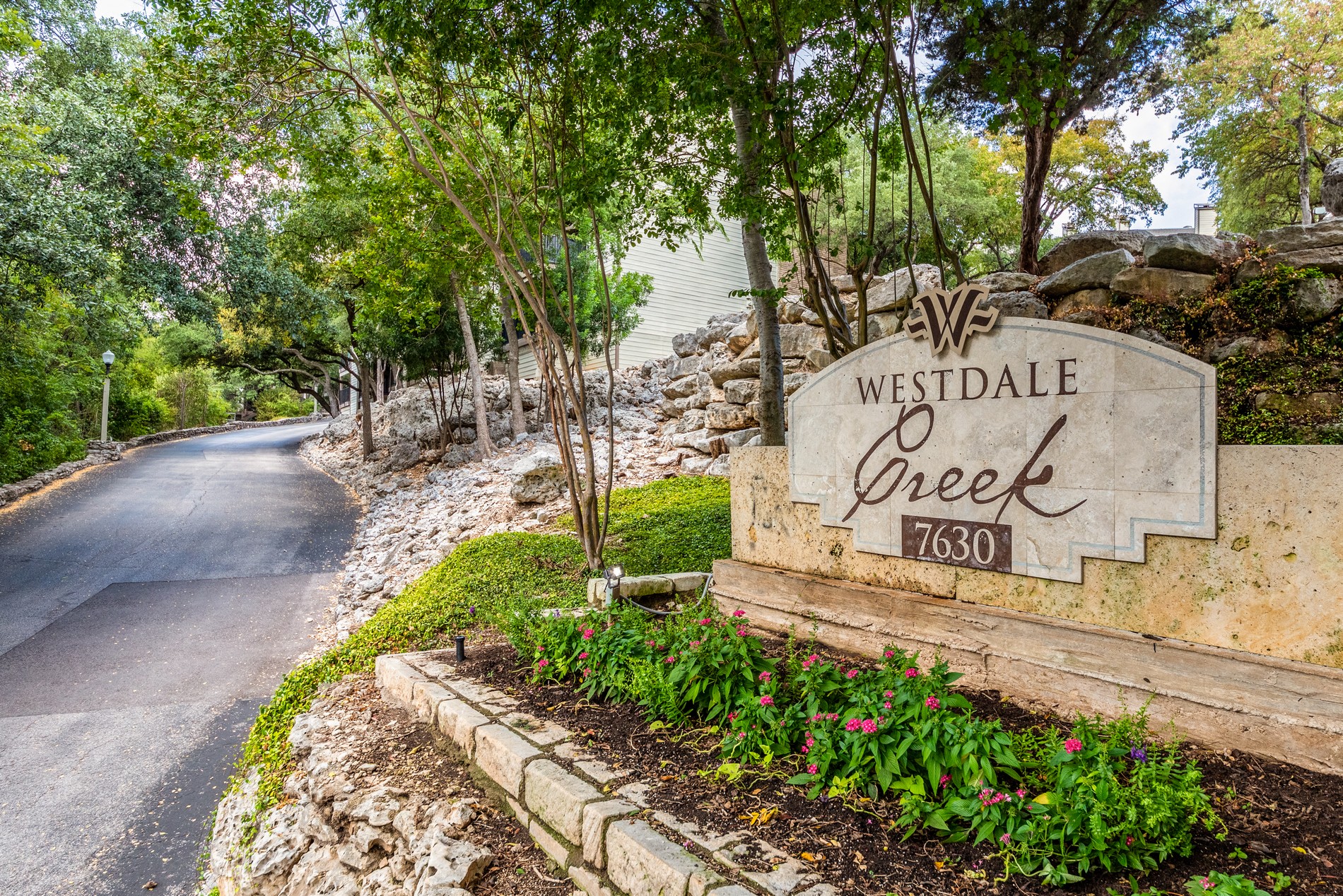 a sign for westdale greece at the end of a road