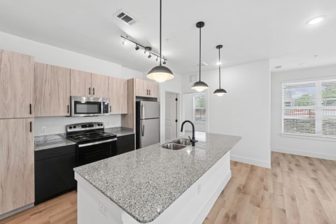 Kitchen of Model Unit at Whispering Pines in Euless, TX
