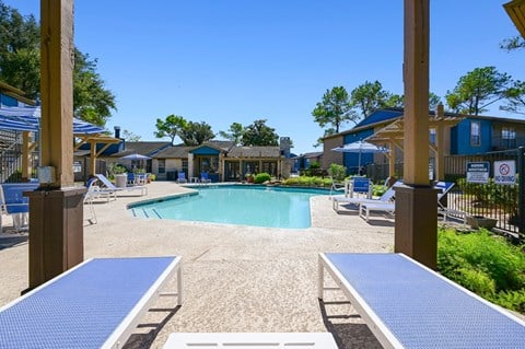 our resort style swimming pool is surrounded by our buildings and picnic tables