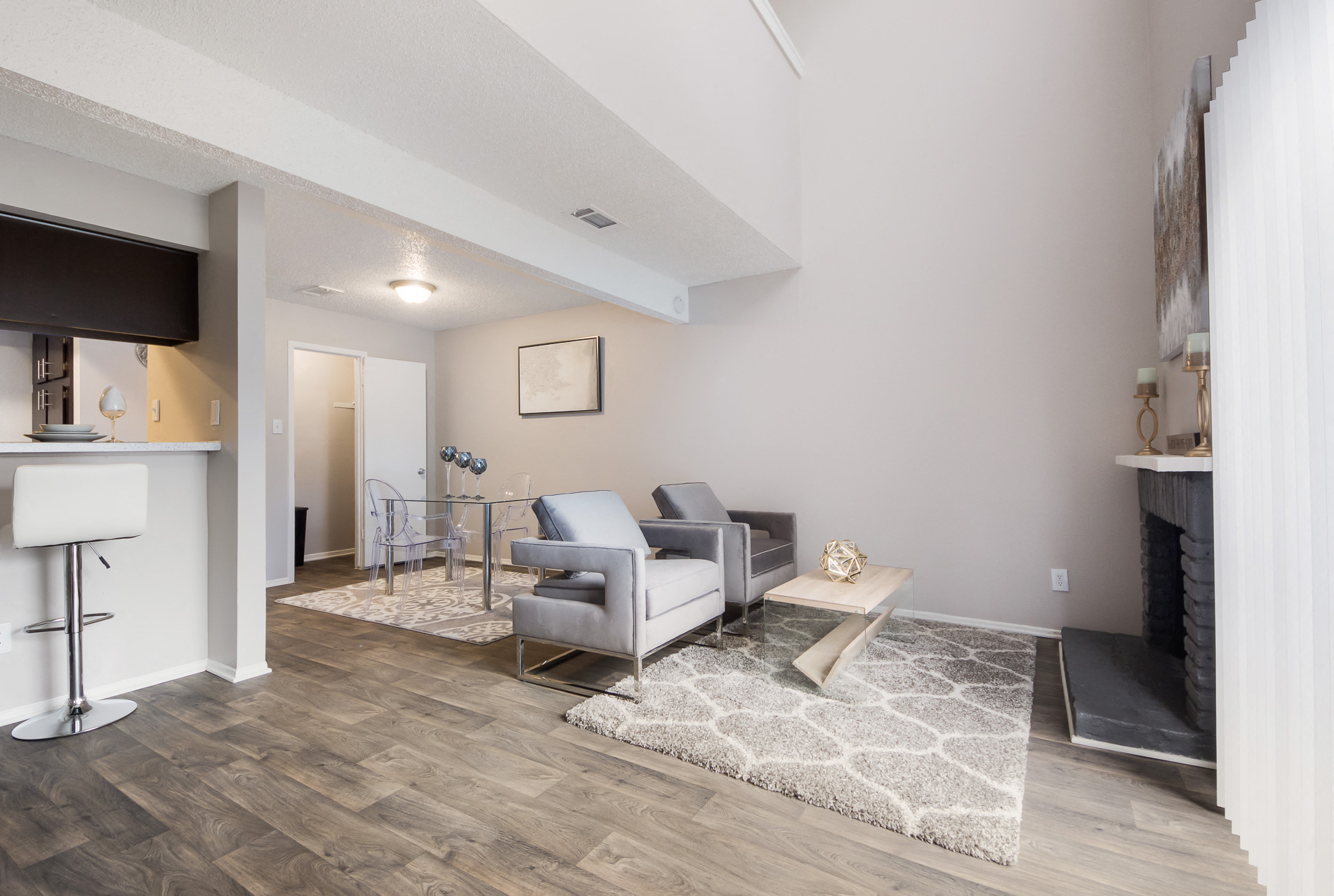 a living room with gray couches and a coffee table