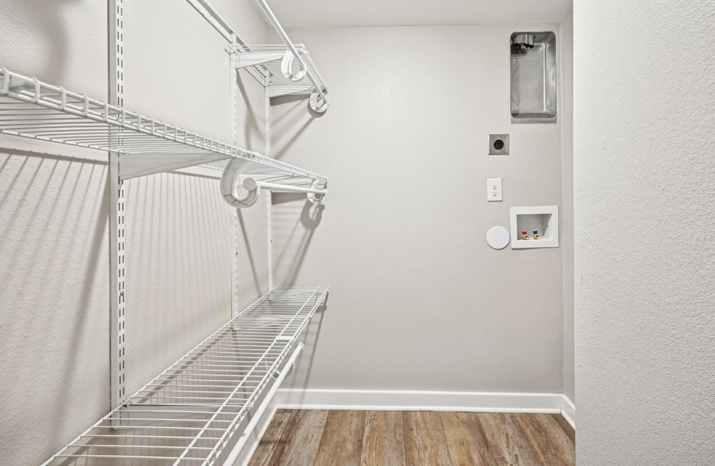 Convenient and spacious laundry closet in the D5 floor plan at Windridge On The Parkway Apartments in Dallas, TX