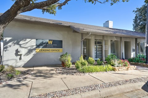 exterior look of the leasing pffice at Woodlands of Plano in Plano, TX