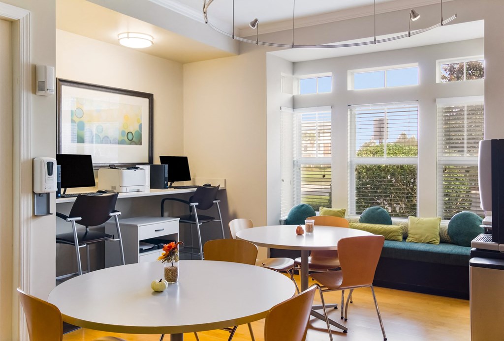 a living room with a table and chairs and a couch