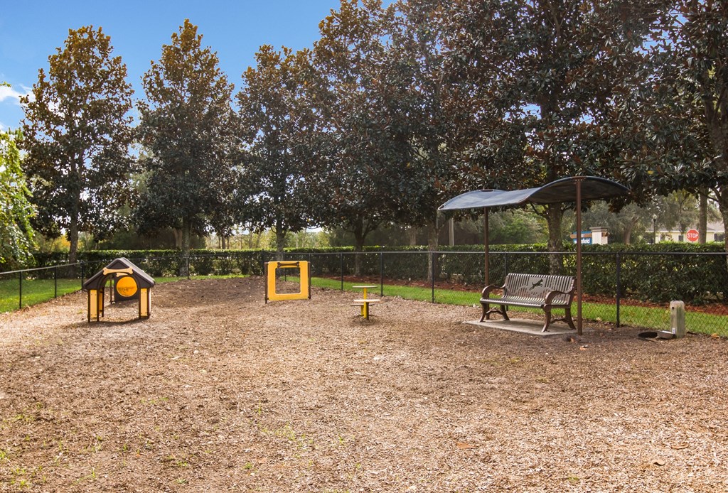 a park with a playground and a bench