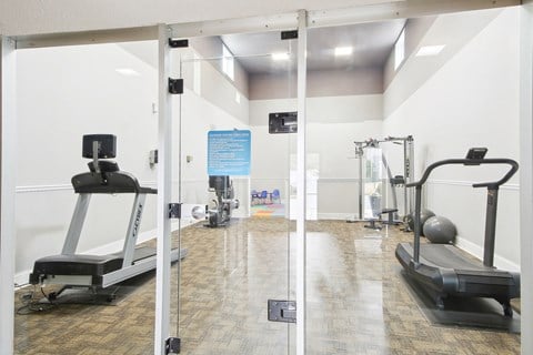fitness center with cardio and multifunctional cable machine, Arrowood Crossing in Charlotte, NC