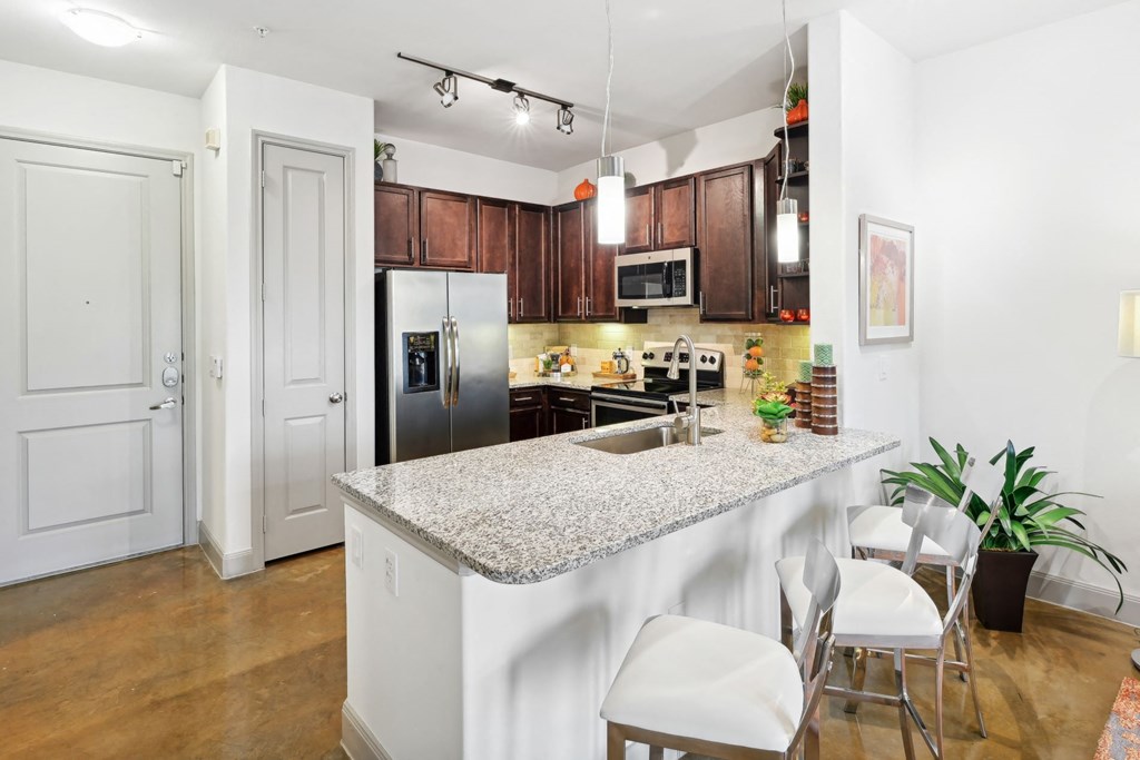 a kitchen at Allusion at West University, Houston, TX