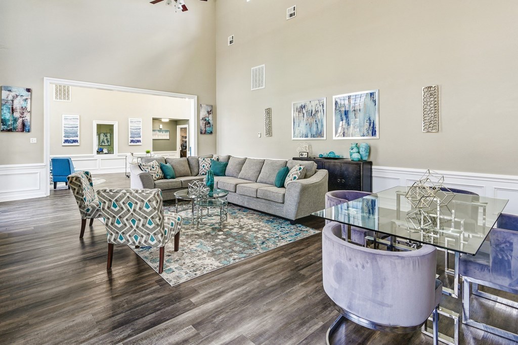 a living room with couches and chairs