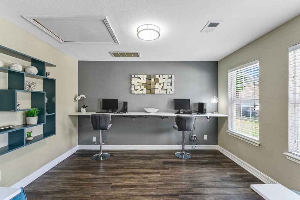 Business Center with two computers and tall chairs at Bear Creek Crossing in Houston, TX