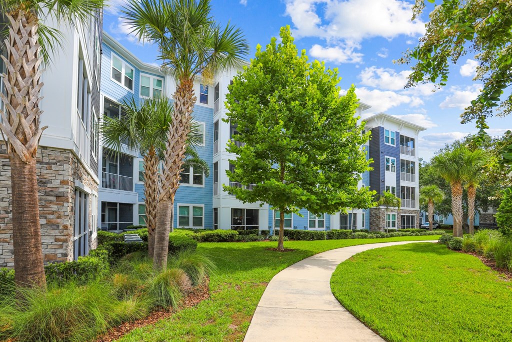 Sidewalk leading to our luxury apartment buildings at Dunedin Commons apartments in Dunedin, FL