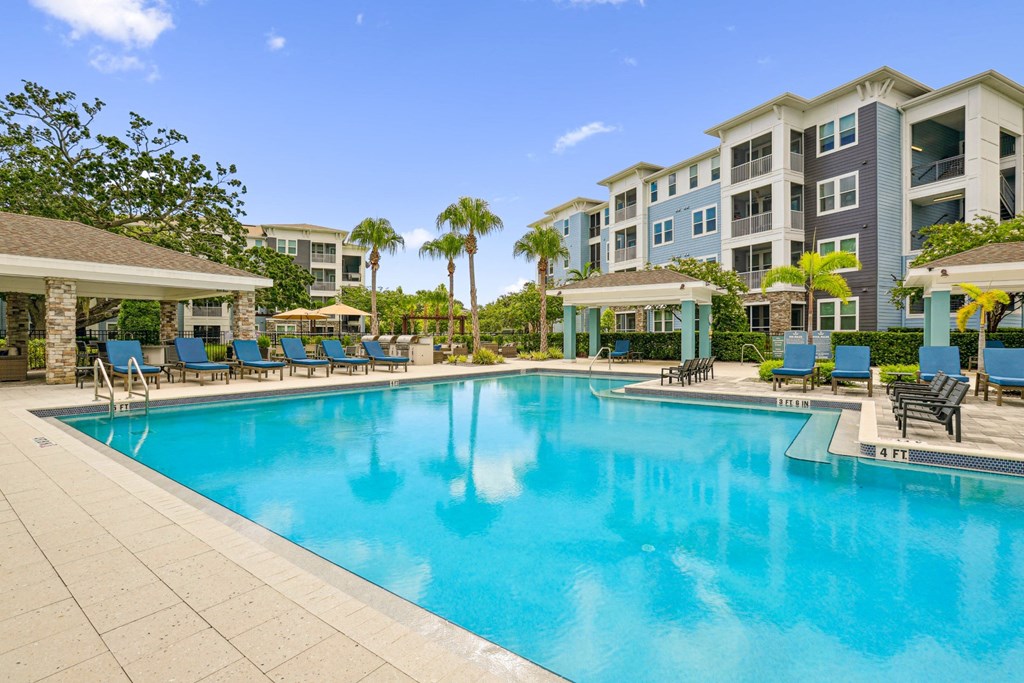 Beautiful resort-style pool at Dunedin Commons apartments in Dunedin, FL