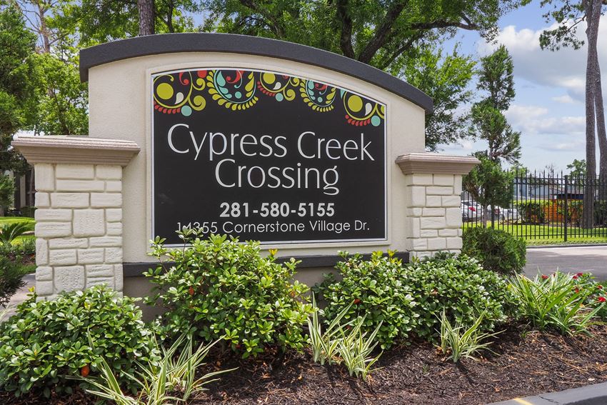 a sign at the entrance of cypress creek crossing