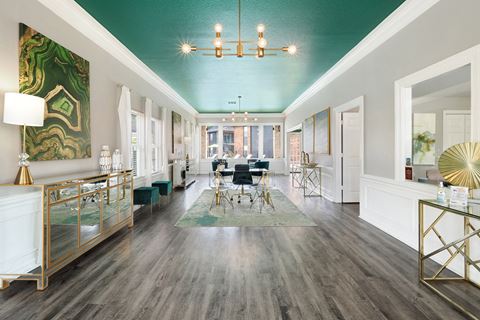 a living room with a teal ceiling and white walls