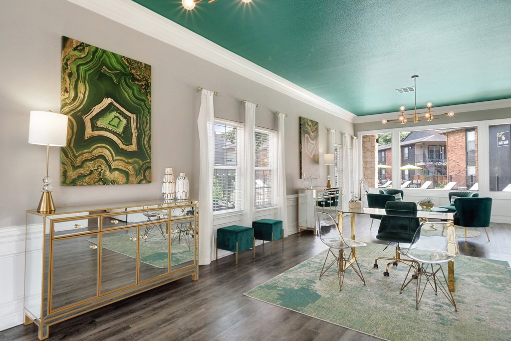 a living room with a green ceiling and white walls