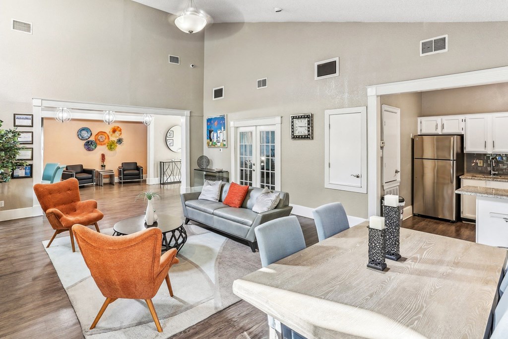 Leasing office lounge area with couch and chairs at Hunters Chase in Austin, TX