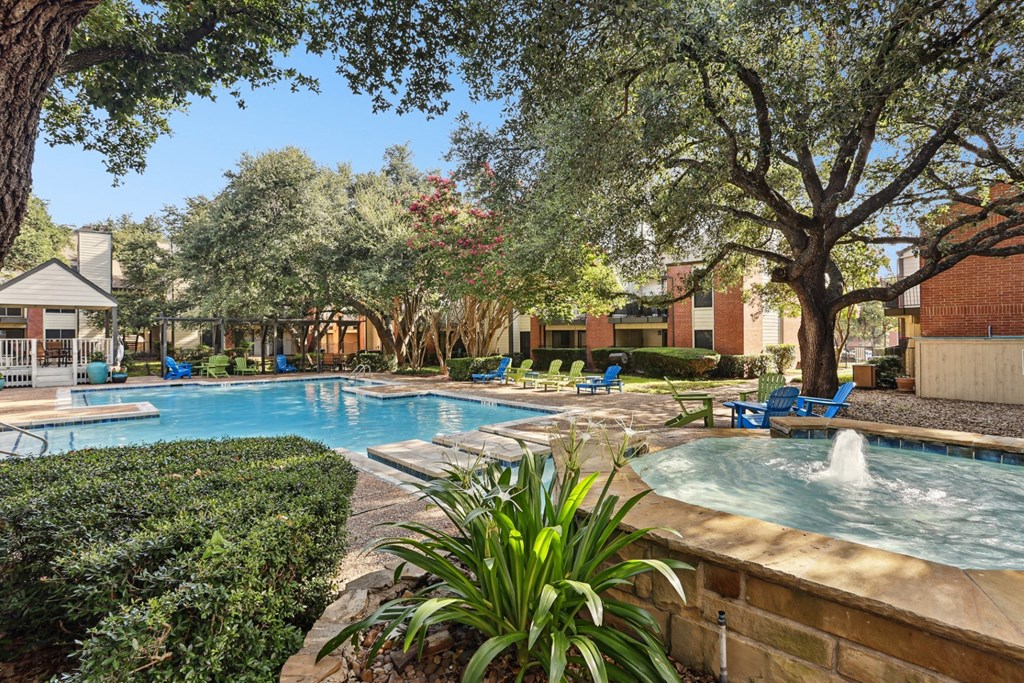 Swimming pool with a fountain at Hunters Chase in Austin, TX