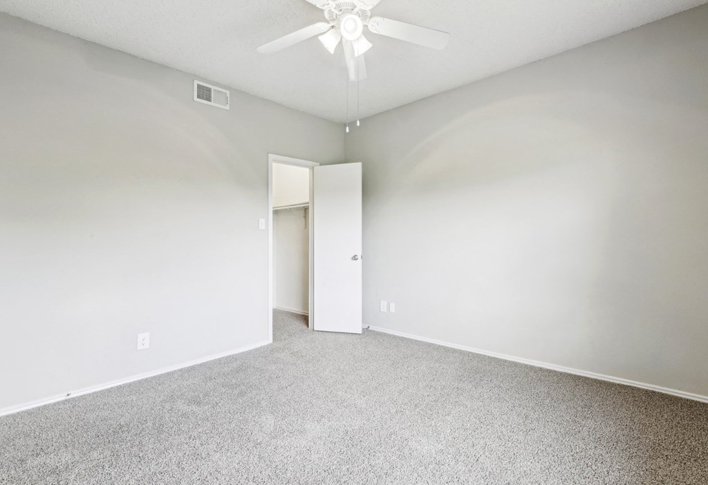 A2 floor plan bedroom with ceiling fan at Jefferson Creek Apartments in Irving, TX.