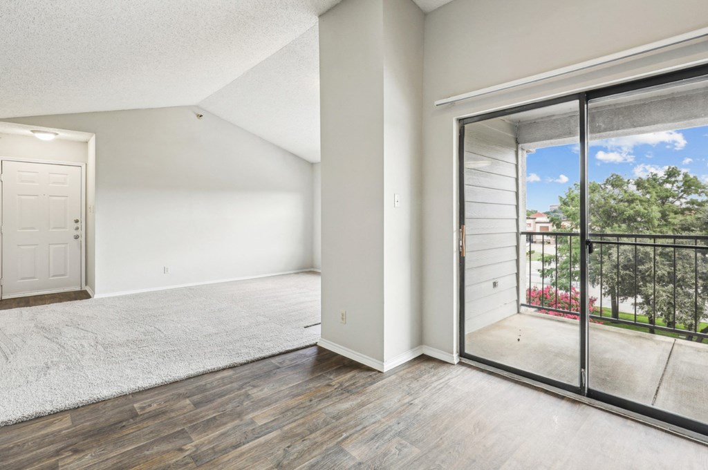 A3 floor plan living room with sliding glass doors to a balcony at Jefferson Creek Apartments in Irving, TX.