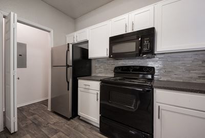 Black Kitchen Appliances at Jefferson Place Apartments in Irving, Texas, TX