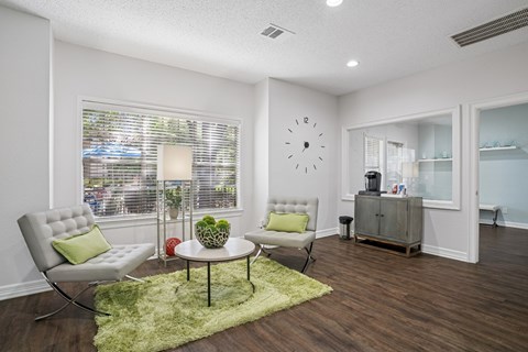 Business center with a coffee maker and seating at La Costa Apartments in Plano, TX