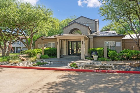 Exterior shot of the leasing office at La Costa Apartments in Plano, TX