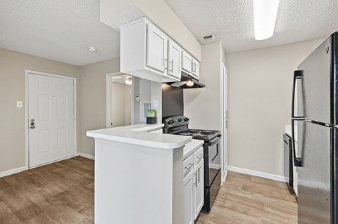 A Unit kitchen at Hollows in San Antonio, TX