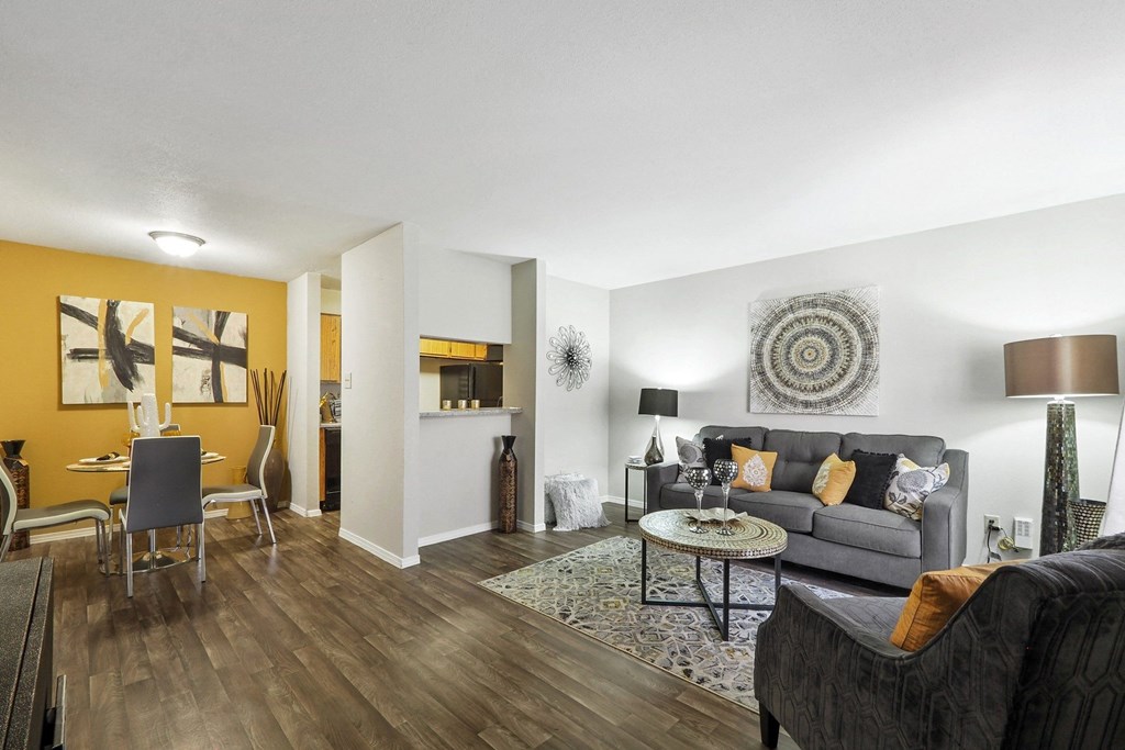a living room with a yellow accent wall