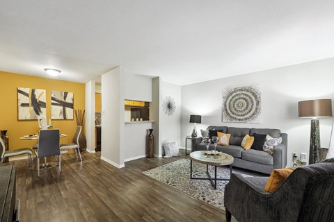 a living room with a yellow accent wall