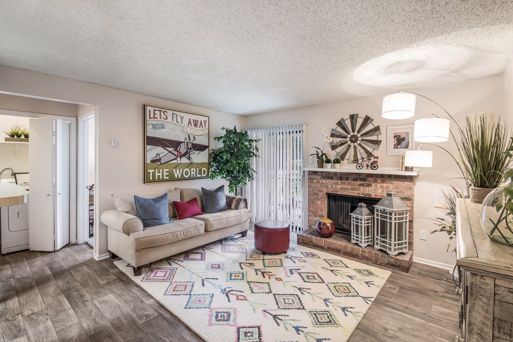 the living room of a house with a couch and a fireplace