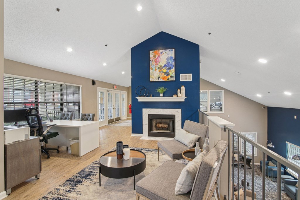 Leasing Office with lounge seating at fireplace at Woodmere Trace at Duluth, GA