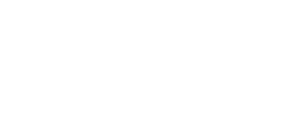 A green sign with white text that says "Woodmere Trace Apartment Homes".