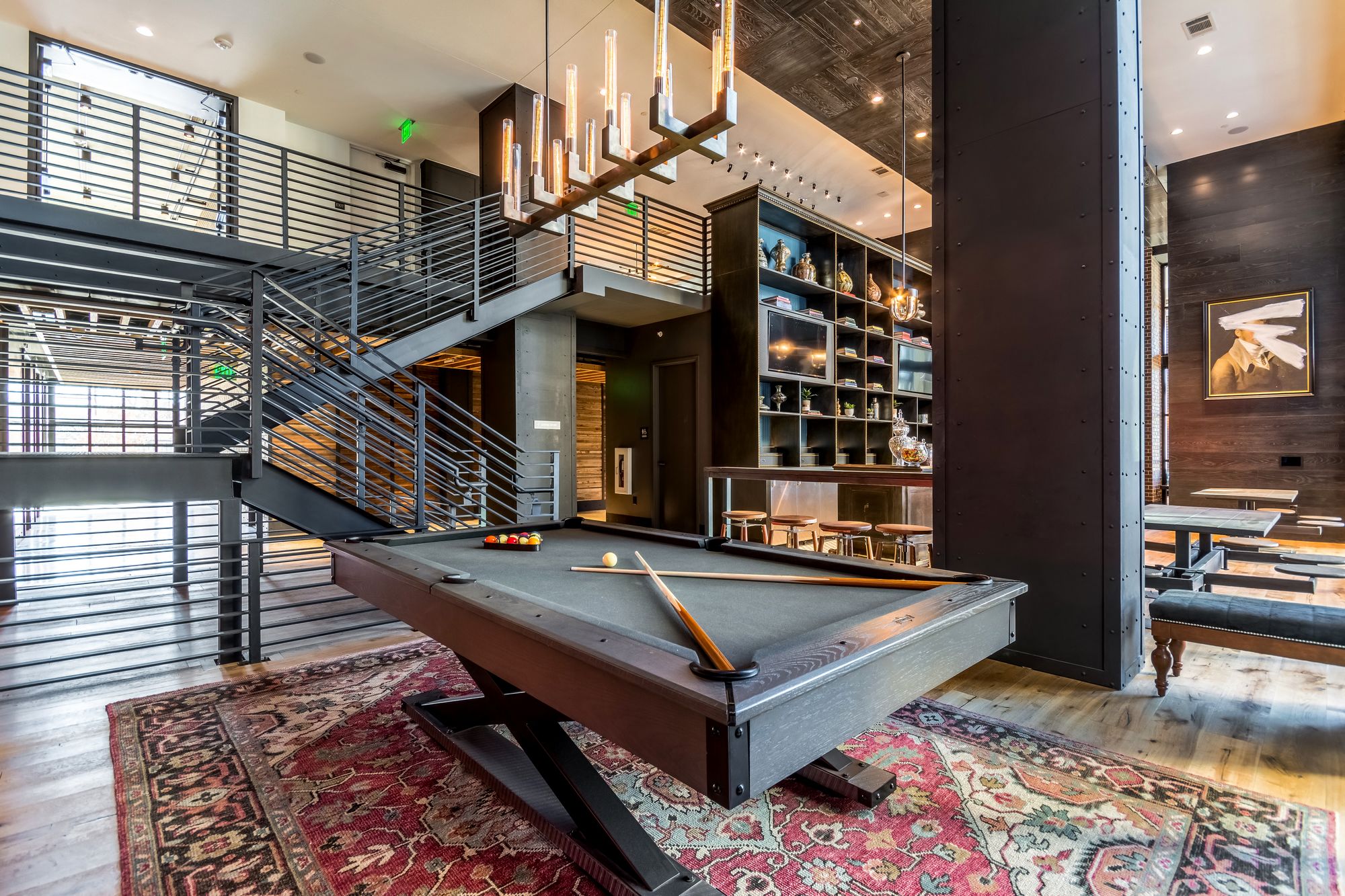 Billiards table sitting inside of a decorative game room at The Case Building in Dallas, TX