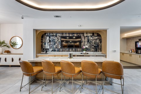 Clubhouse kitchen with bar stools at Era Apartments in Denton, TX