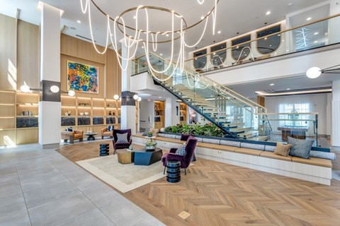 Lobby area with string light chandelier at Era Apartments in Denton, TX