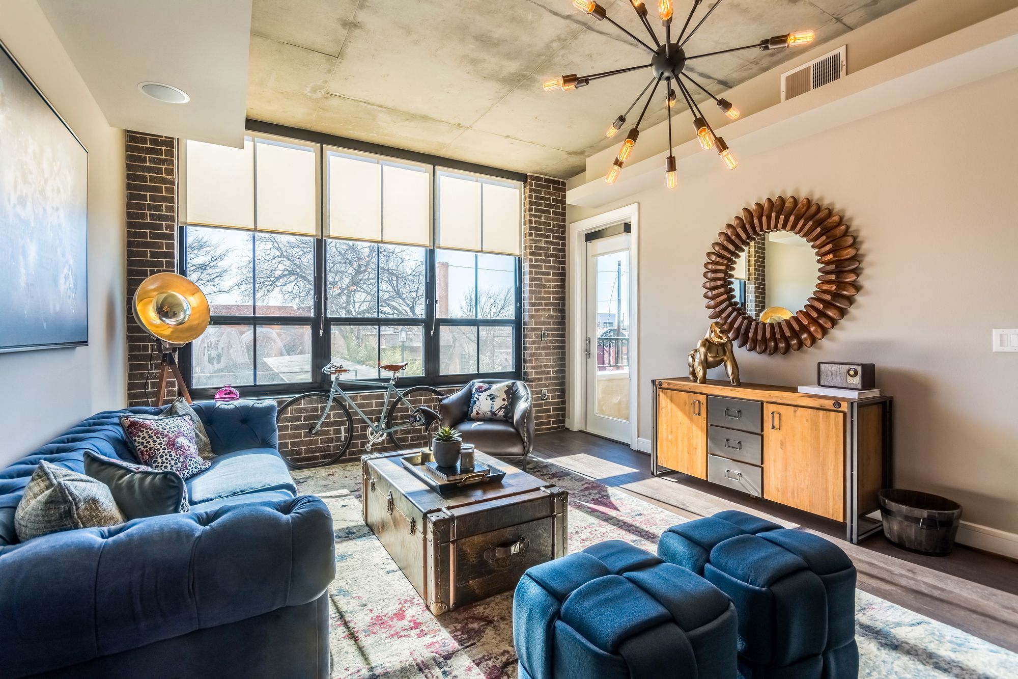 Large living room of apartment with posh decorations at The Case Building in Dallas, TX