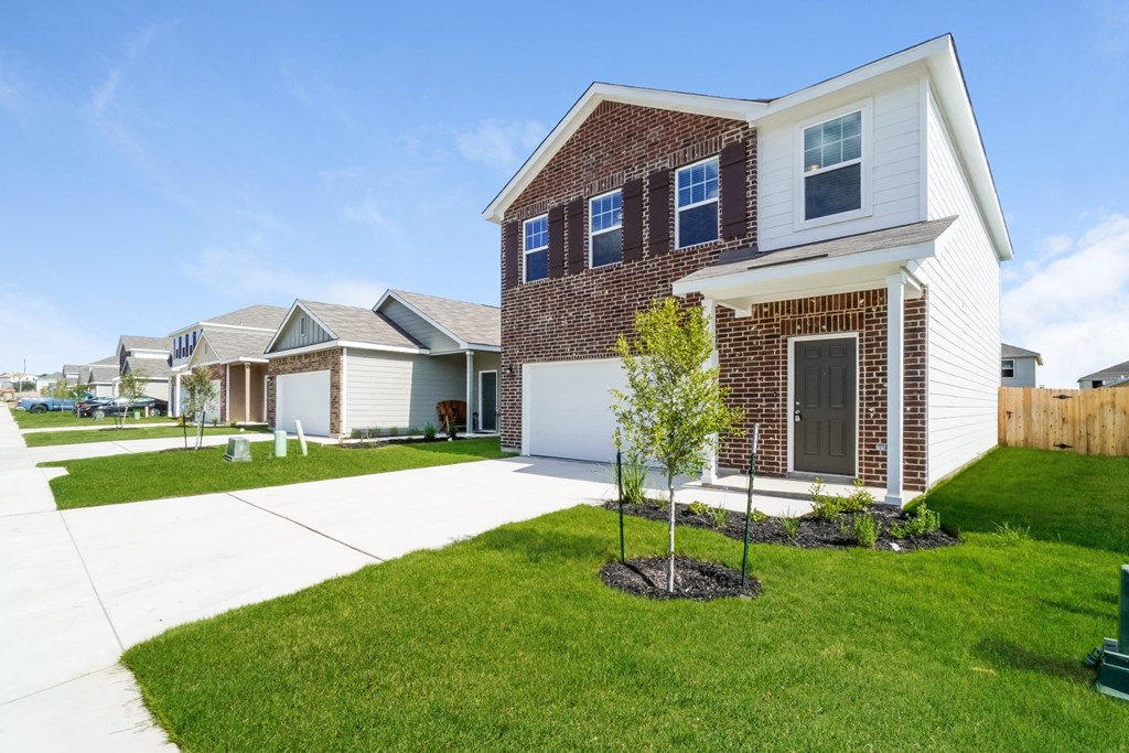 a house with a lawn in front of it at Beacon at Meridian, San Antonio, 78245