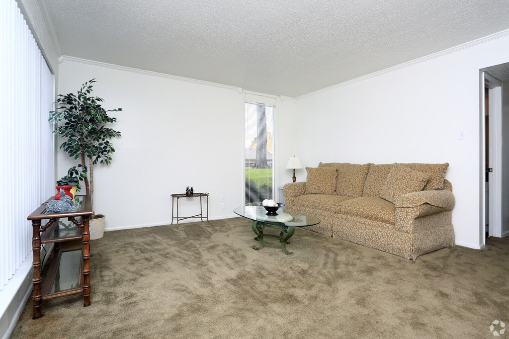 a living room with a couch and a table