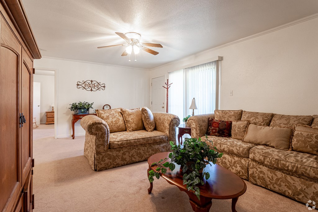a living room with couches and a coffee table