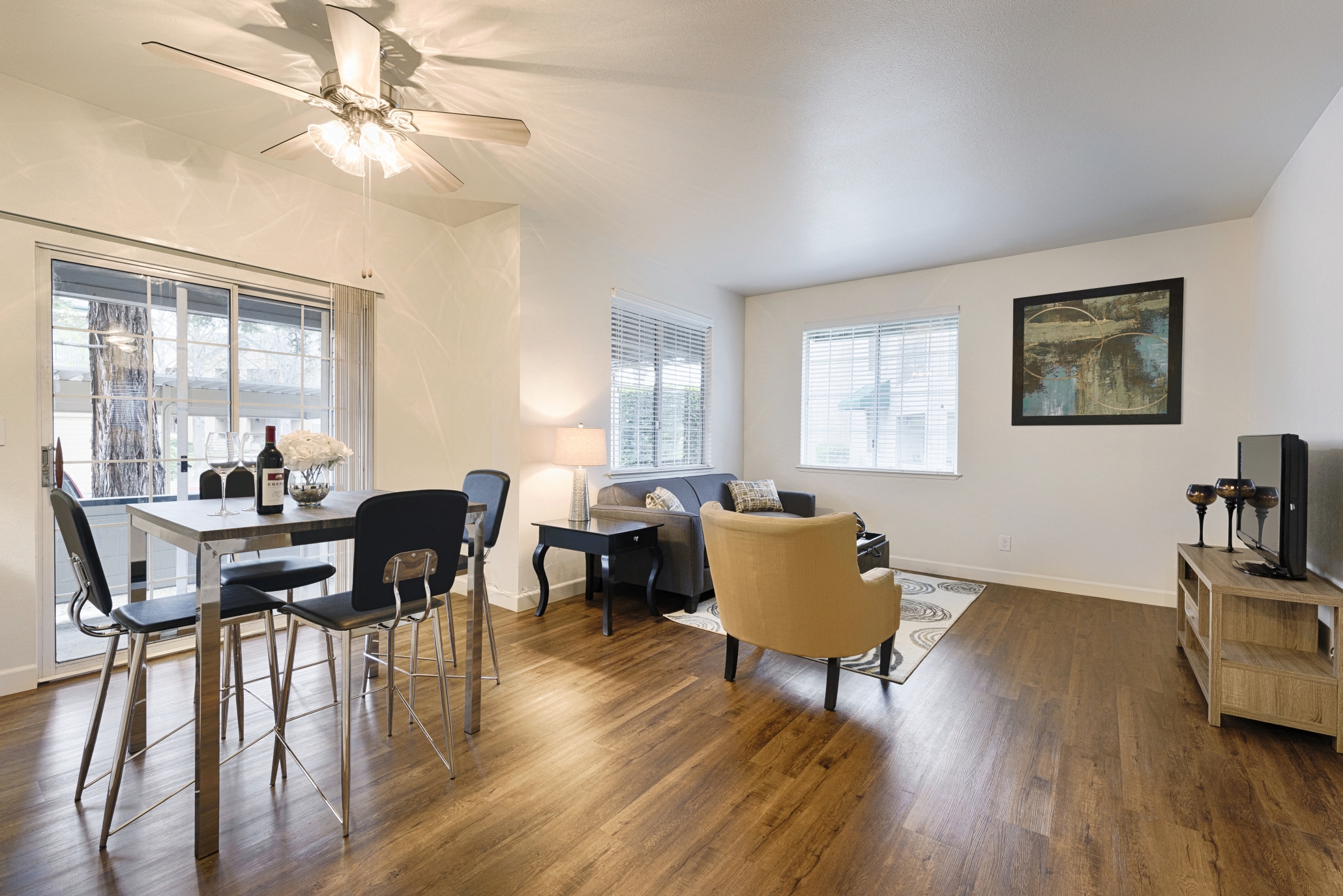 an open living room and dining room with a table and chairs