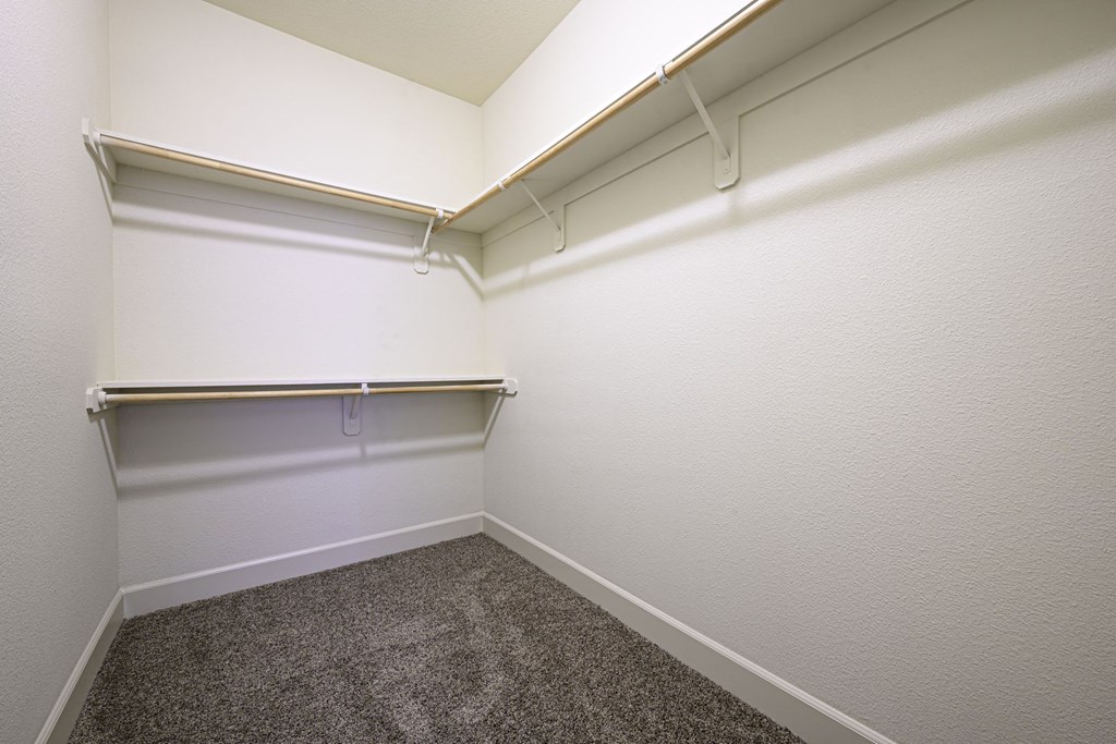 a small room with a carpeted floor and white walls