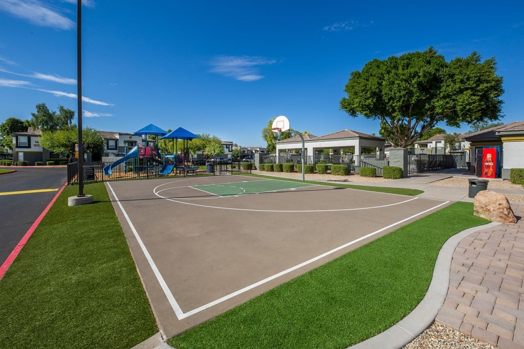 a basketball court at the enclave at green valley apartments