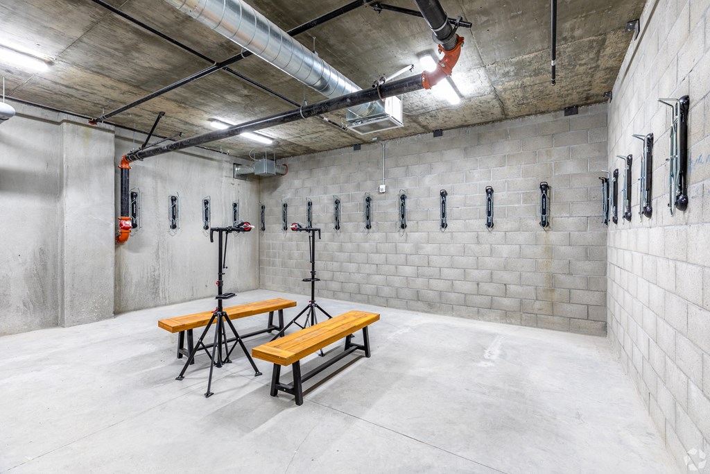 a large storage room with benches and a table in it