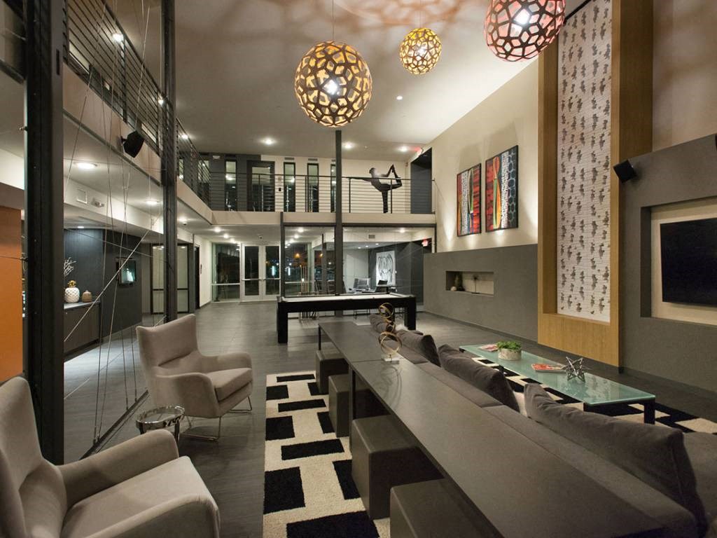 Lobby Tv room with multiple seating options and 75 in. TV