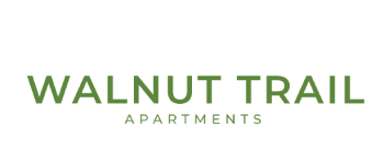 A sign that says Walnut Trail Apartments.