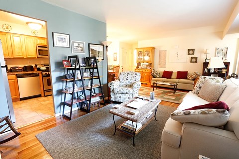 A living room with a couch, chair, and coffee table.