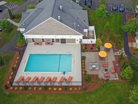 A large house with a pool in the backyard.