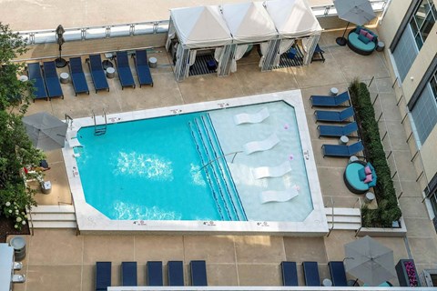 A rectangular pool with a white diving board.