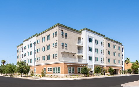 A large white building with a green roof and a number 1510 on it.