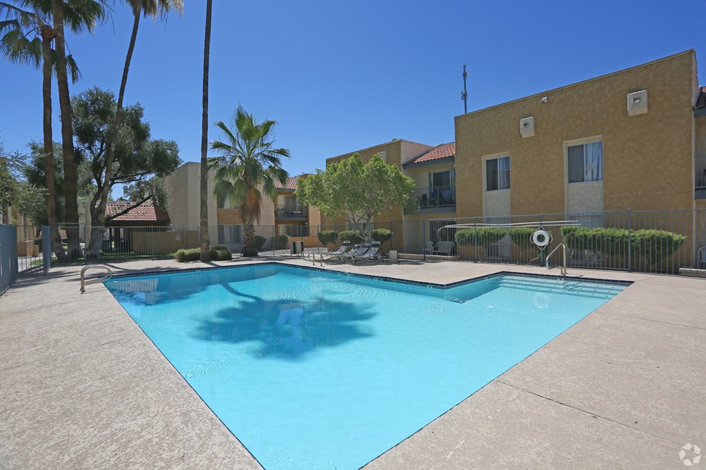 a large swimming pool in front of a building